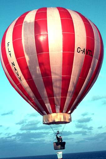 [ Balloon rising with mail sack attached to basket - 22Kb ]